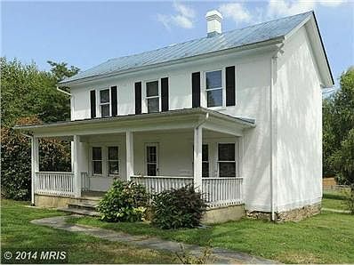 C. 1909 Traditional stucco farmhouse.