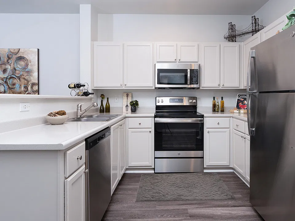 Stainless steel appliances and ample cabinetry bring style and functionality to the kitchen