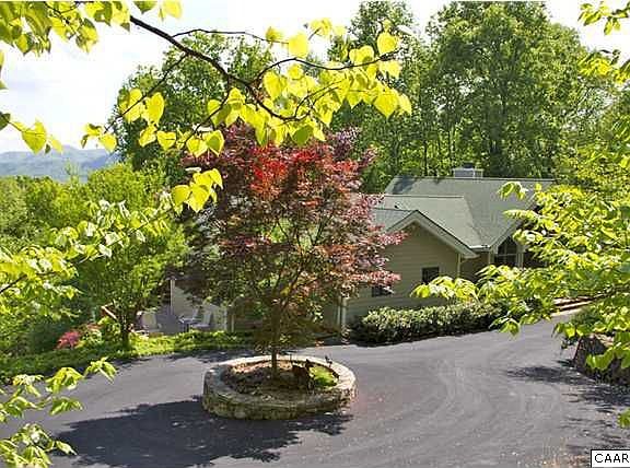 Home has a beautiful mature landscape