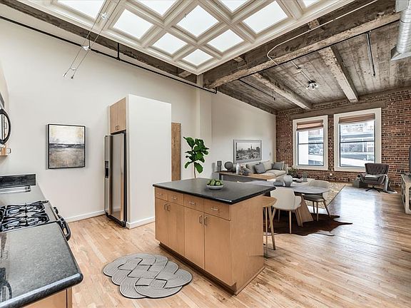 Virtually staged kitchen to living area, gives you an idea of the spacious open living area.