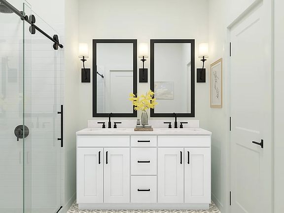 Primary bath features vanity with dual sinks