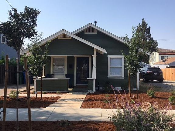 Front porch with private on-site parking for two (2) cars to the east