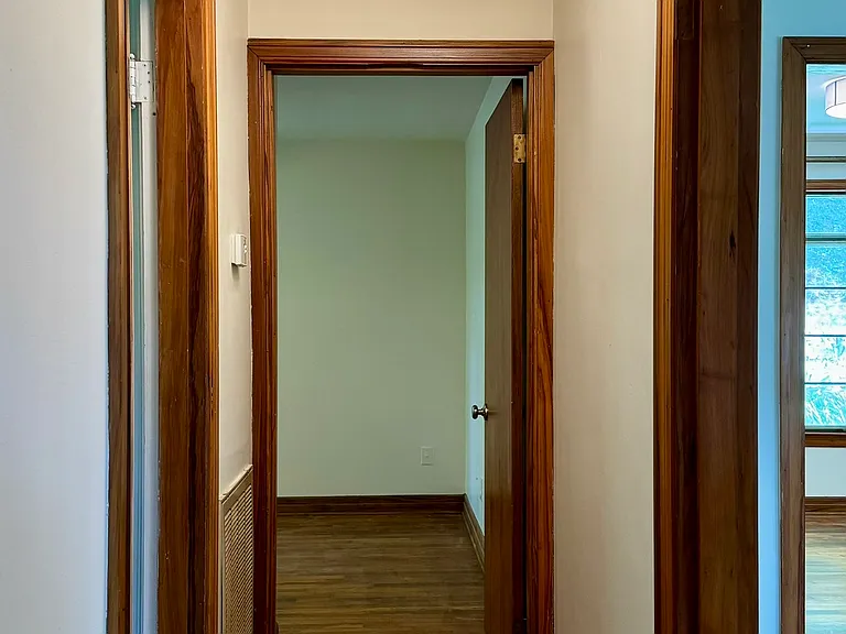 Hallway between Bedrooms 1&2 (Bathroom 1 to the left).