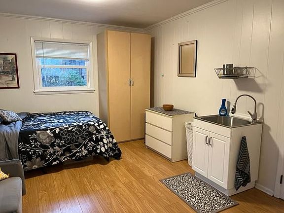View of Calafornia closet and large kitchen sink.