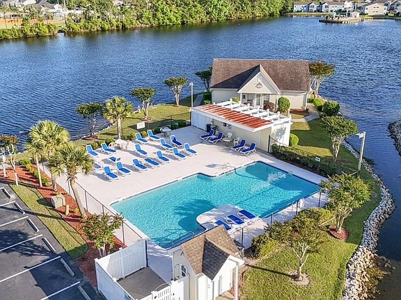 Front of Subdivision pool. Has one in back as well. mail box area is in front of subdivision & Bus Pick up.