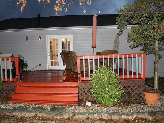View from the backyard looking towards the back of the house, including the deck.