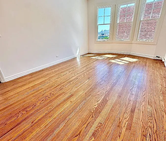 Unit #602 massive, sun filled bedroom with recessed can lighting and huge bay windows!