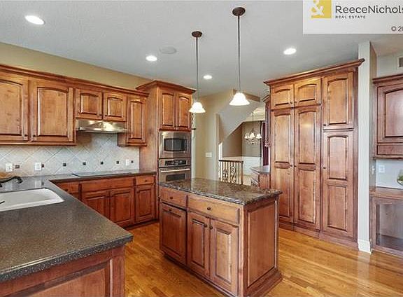 All Maple Cabinetry with hidden hinges, lots of counter space. Bubble-Glass Cabinet Doors, under/above cabinet lighting. Keyless entry from garage, screened-in porch, 2nd bedroom or office.