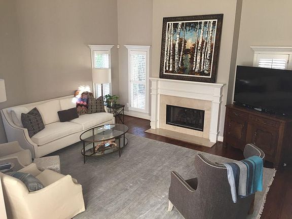 Large Living room with 2 story ceiling and gas log fireplace