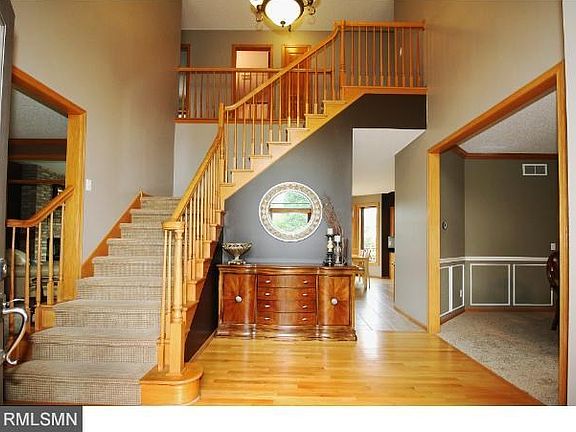 Grand entrance is 2-story with high windows, wood floors, and a new beautiful front windowed entrance door with side windows