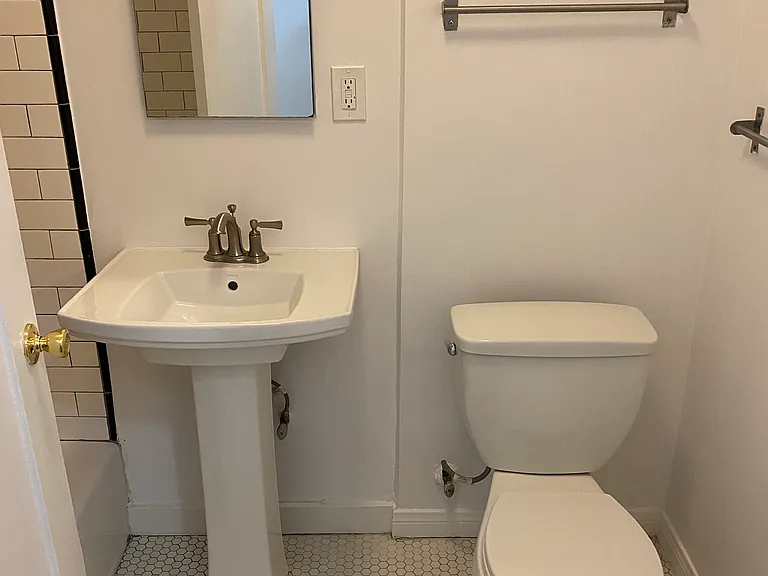 Vintage Bathroom 1 With Subway Tile Shower and Kohler Brand Plumbing Fixtures