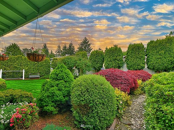 Walk through this dreamy garden path to the back yard!