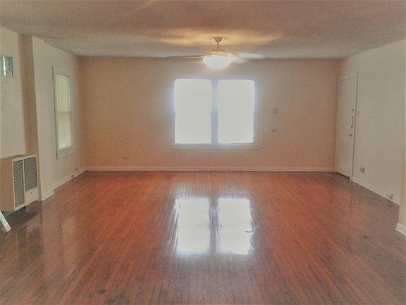 liv room: from rear to front door and windows (huge)
