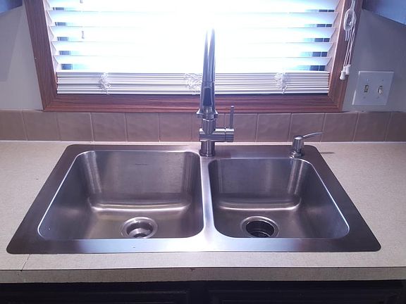 New stainless steel kitchen sink with 9" and 11" deep bowls