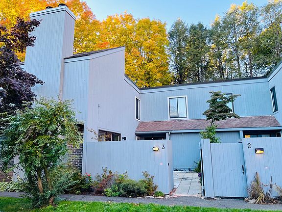 Front of unit with gate to courtyard.