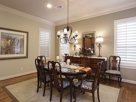 The Dining Room, as the rest of the home features plantations shutters and intricate mill work.