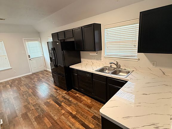 Open kitchen with lots of amenities.