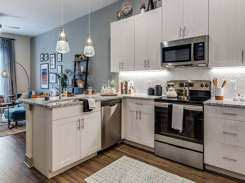 Griffis Frisco apartment kitchen with granite countertops.