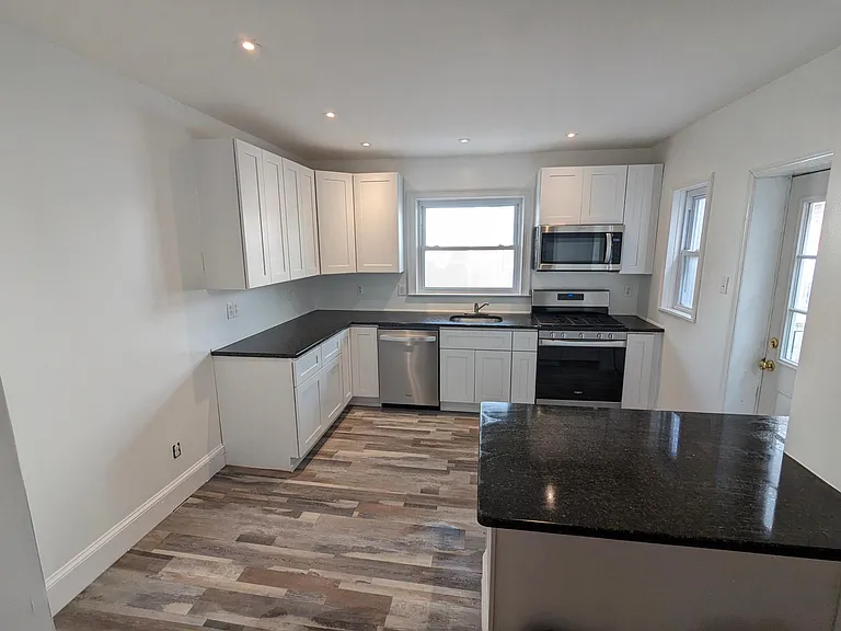 Newly renovated. Brand new everything. New wood cabinets. New stainless steel appliances. New granite countertop. New fridge is included, not pictured.