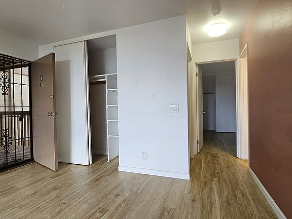 Entry security gate allows cool breeze and privacy, relaxation. Additional closet storage at the entrance.