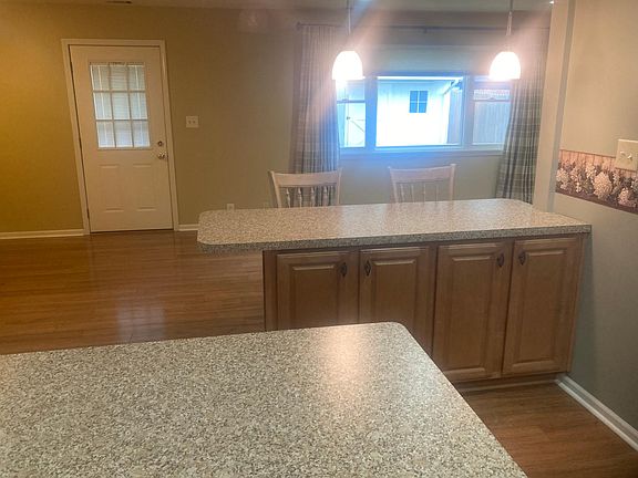 View from the kitchen to the family room and door leading to back yard ...