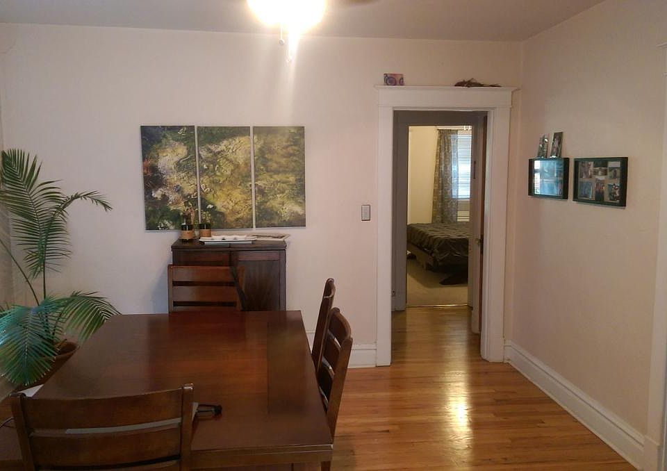 Dining room with small bedroom door on the right