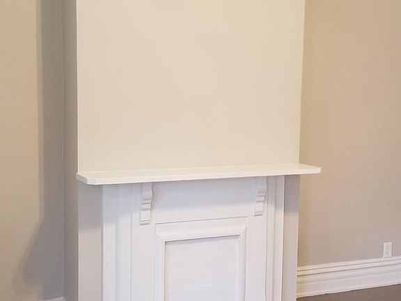 Living room with inoperable fireplace.