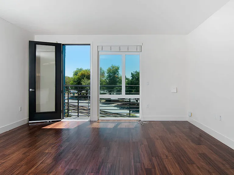 Living Room with Balcony and Hard Surface Flooring