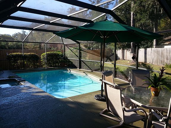 Screened pool area and nice backyard