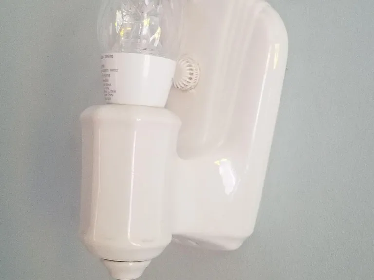 This is one of two ORIGINAL light fixtures in the 2nd floor bath from 1927.