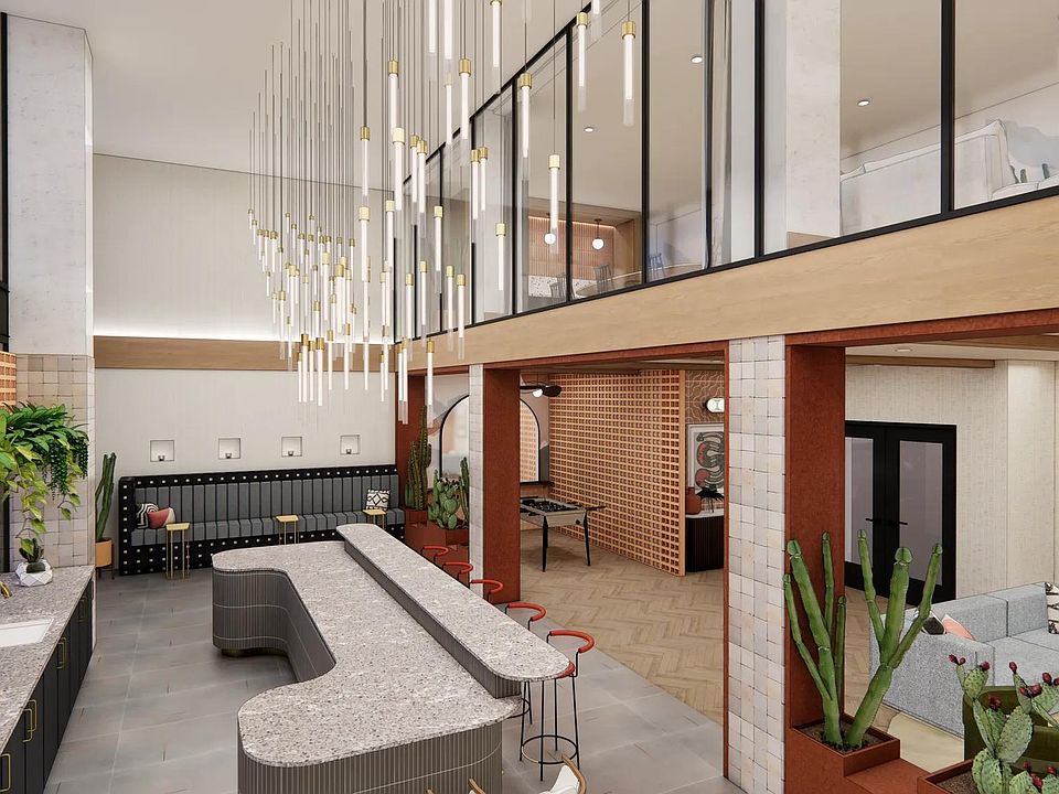Entertain guests in the clubroom featuring a gathering space and bar area.
