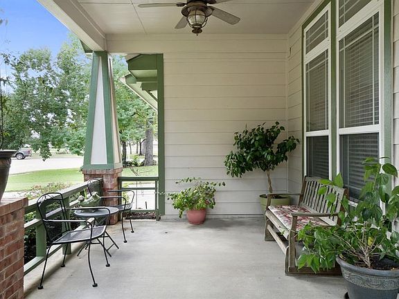 The front porch not only has plenty of space to lounge, but you will stay cool with the outdoor ceiling fan as well.