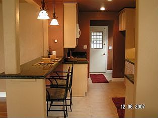 What a beauty! New granite counters, maple cabinets & tile floors.