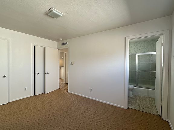 Bedroom 2 with another vintage Bathroom and closets full width.