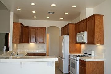 Kitchen w/Oak Cabinetry & Recessed Lighting