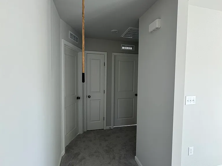 Hallway to bedrooms and loft