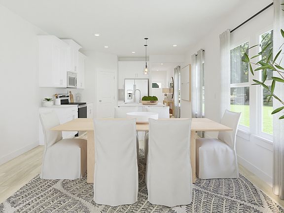 The open-concept floorplan allows for an easy flow between the kitchen and dining areas.
