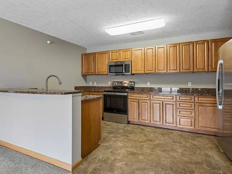 Bring your favorite recipes to life in this spacious kitchen featuring abundant cabinetry and an open design made for easy entertaining.