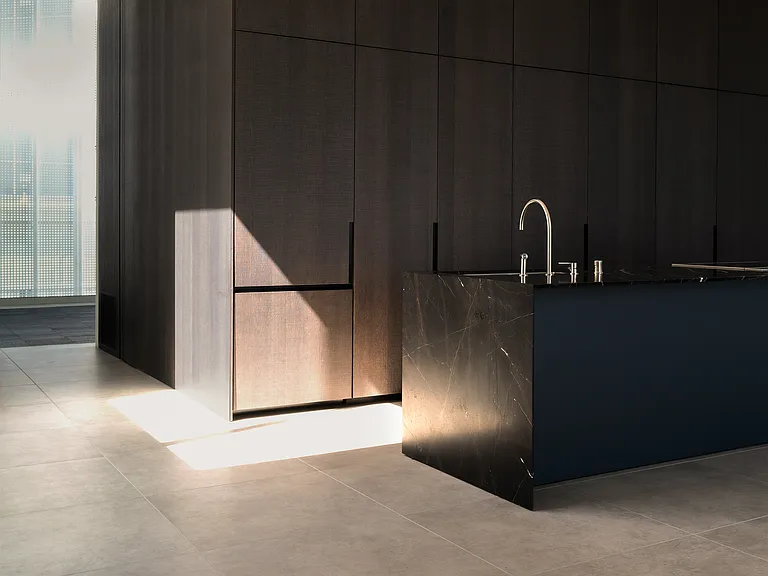 Gourmet Kitchen with Contemporary Finishes _ This state-of-the-art kitchen features custom dark oak cabinetry, soft-close drawers, and integrated Miele appliances, all set against a backdrop of sleek marble countertops and dramatic lighting.