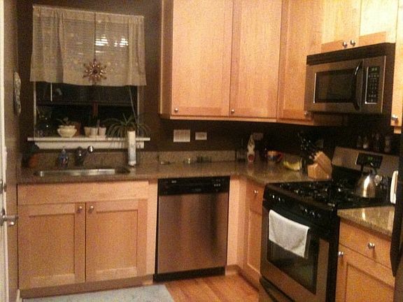 Kitchen with all stainless steel appliances, granite counter