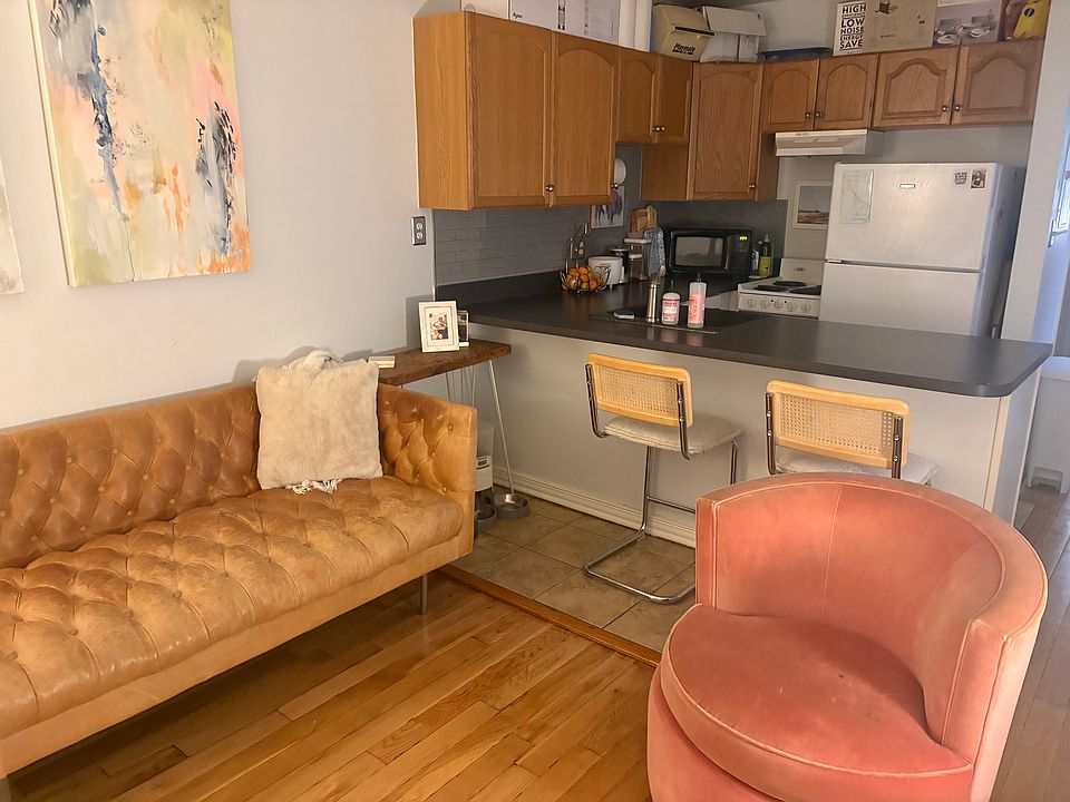 Living Room with breakfast bar. New refrigerator.