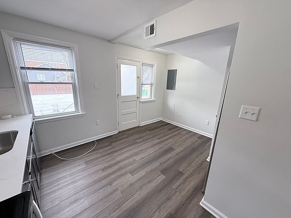 Breakfast Area adjacent to Kitchen and rear door to parking & porch
