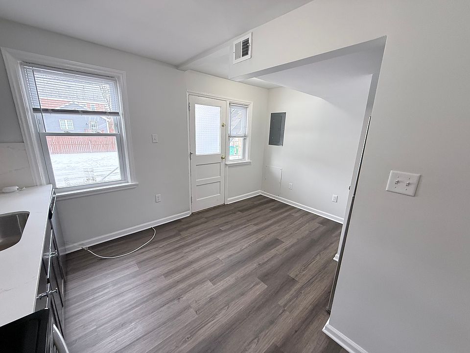 Breakfast Area adjacent to Kitchen and rear door to parking & porch