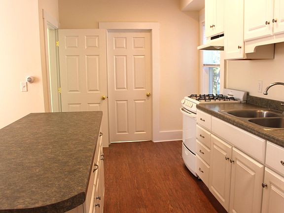 Kitchen to full bath and office/bonus room on left