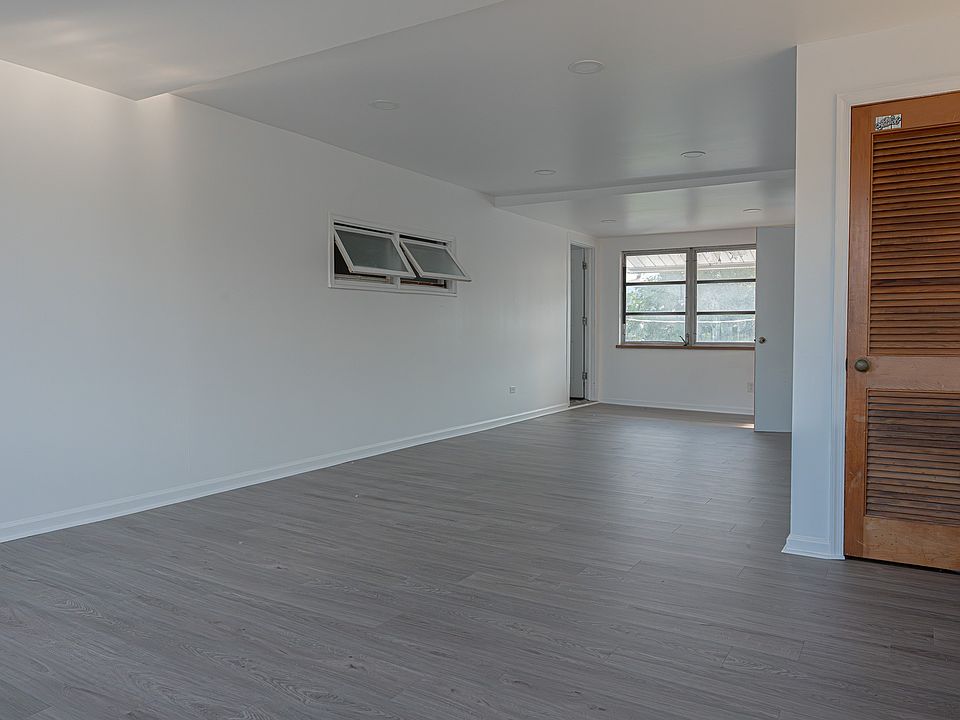 Bright and airy indoor porch offering extra living space with plenty of natural light and storage area.