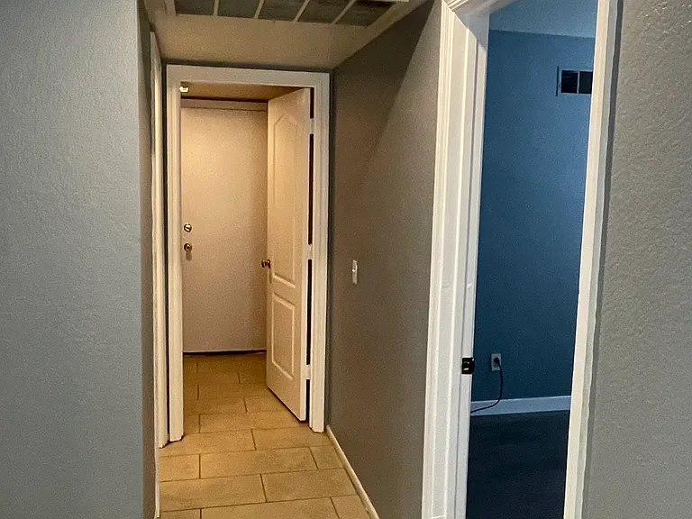 Hallway to laundry and garage