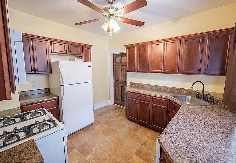 Spacious kitchen large counter tops ton work on.