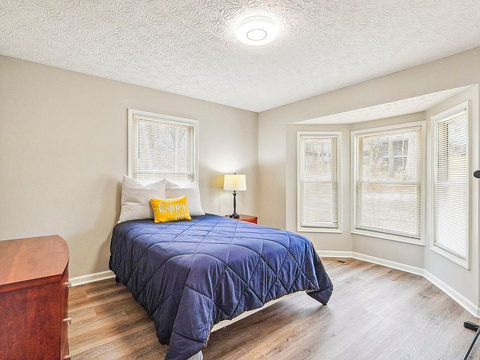 Spacious bedroom with bay window.