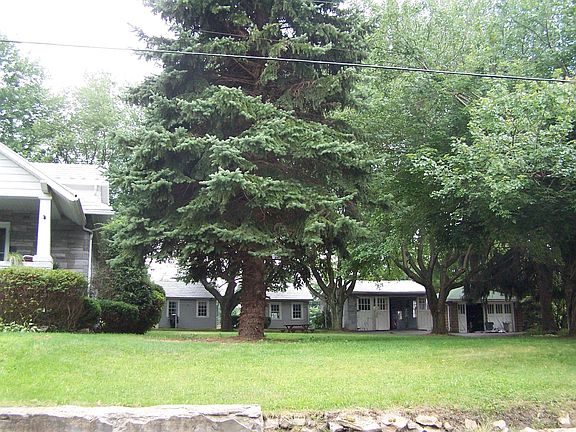 2 Car Detached Garage & 3 Sheds