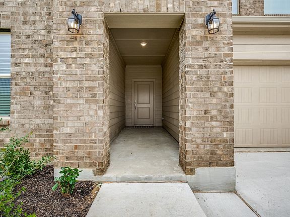 Entrance to property with a garage